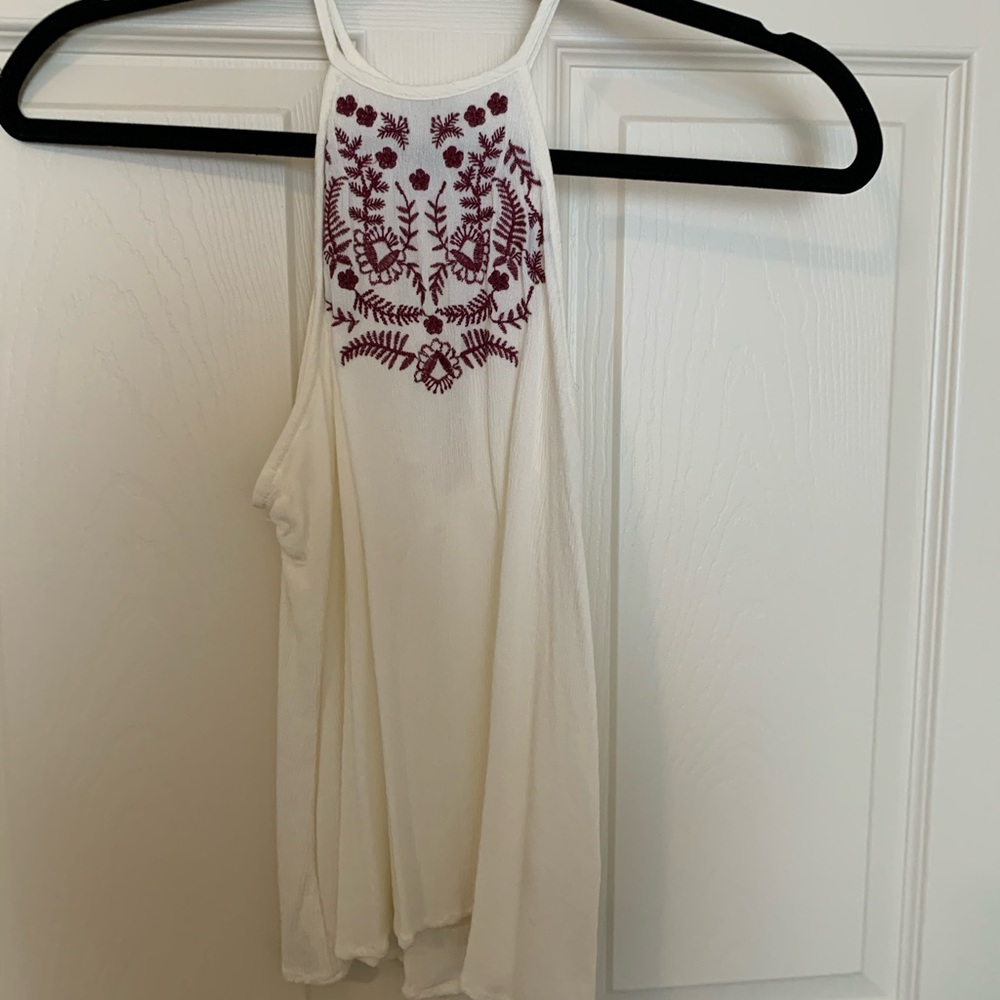 Off white top with burgundy floral designs